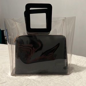 Staud Shirley PVC tote w/removable case. 
• Length 14 1/2” Height 10 1/2”
